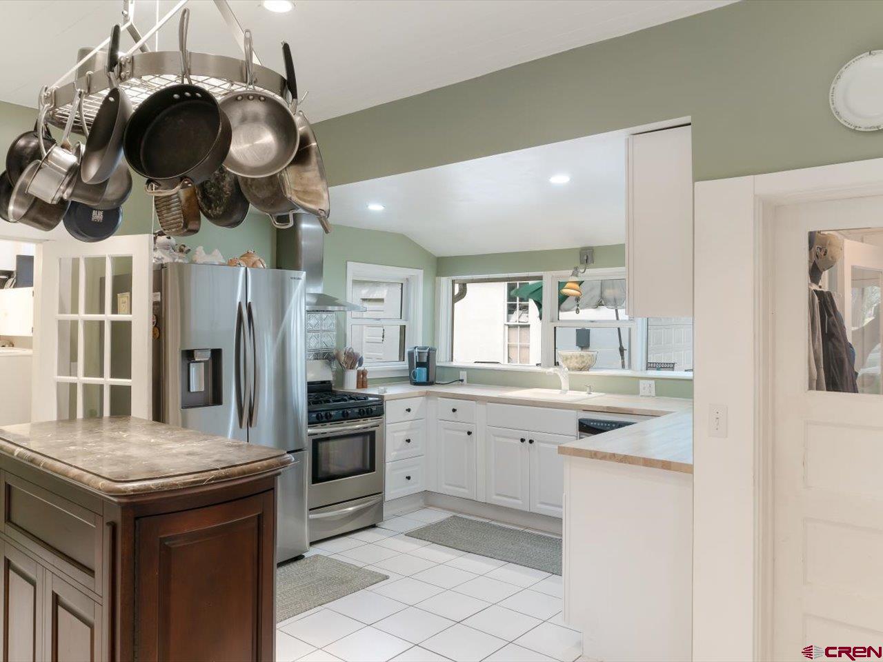 15318 6100th Road Montrose, CO 81403 - Photo 15 of 35 a kitchen with a sink and stainless steel appliances