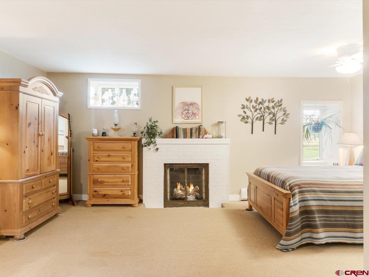 15318 6100th Road Montrose, CO 81403 - Photo 19 of 35 a living room with furniture and a fireplace