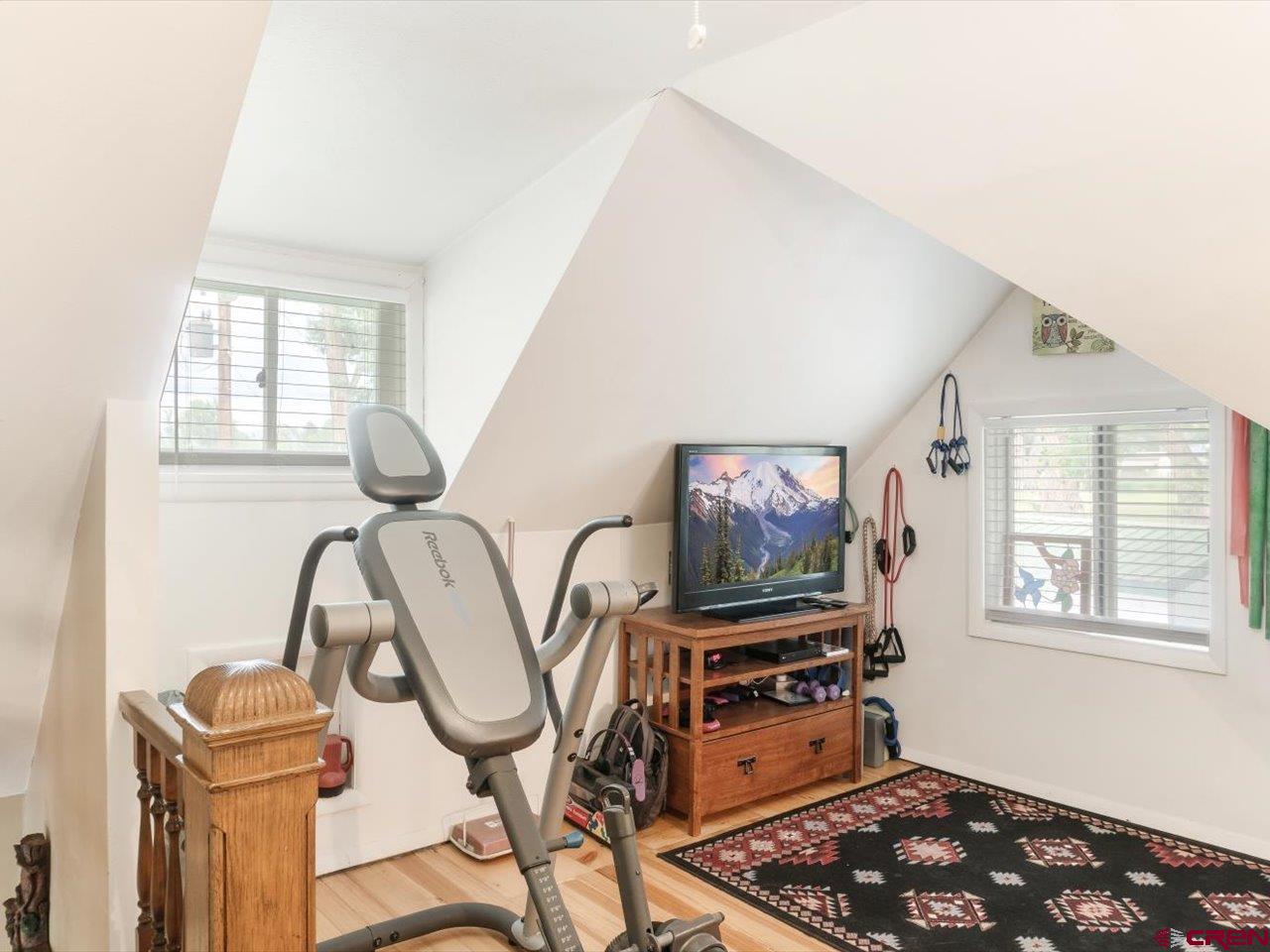 15318 6100th Road Montrose, CO 81403 - Photo 25 of 35 a living room with furniture a flat screen tv and a window