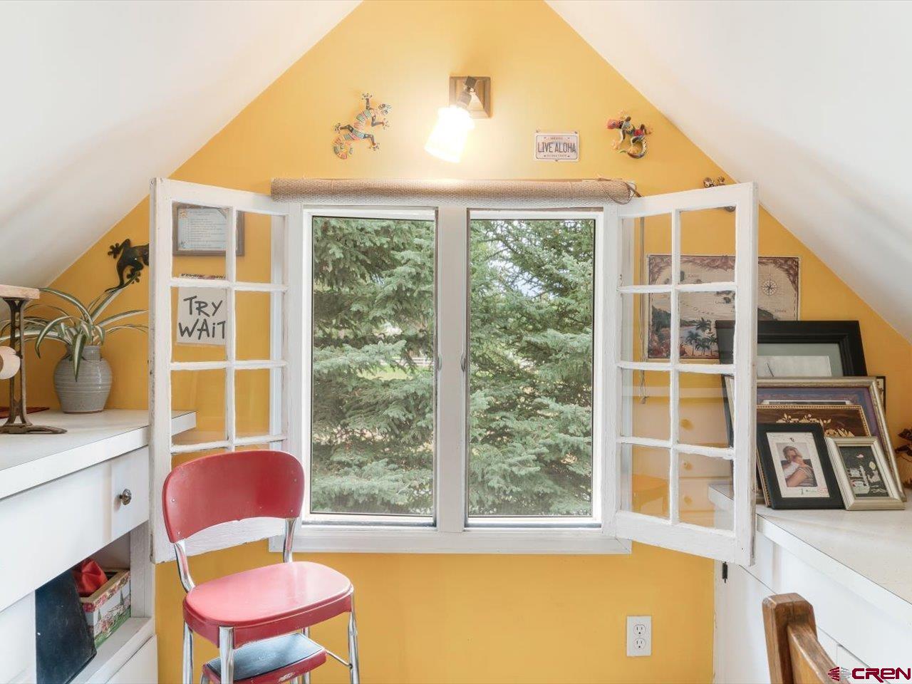 15318 6100th Road Montrose, CO 81403 - Photo 26 of 35 a front view of a house with wooden floor and windows