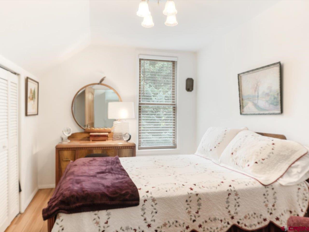 15318 6100th Road Montrose, CO 81403 - Photo 28 of 35 a bedroom with a bed and a dresser