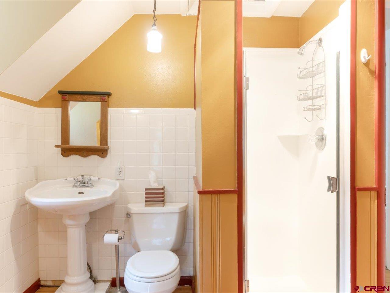 15318 6100th Road Montrose, CO 81403 - Photo 29 of 35 a bathroom with a toilet sink and mirror