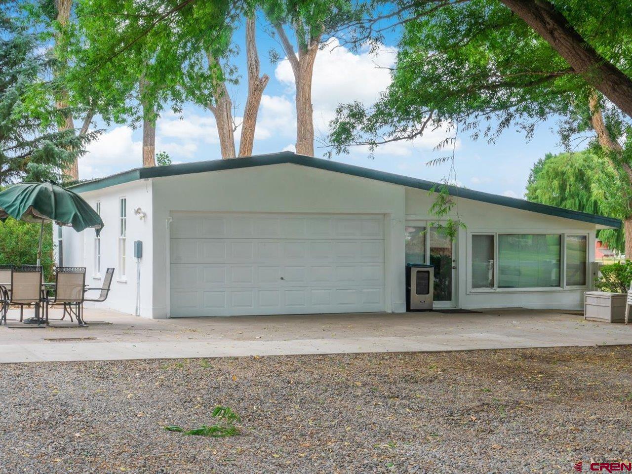 15318 6100th Road Montrose, CO 81403 - Photo 30 of 35 a house with trees in front of it