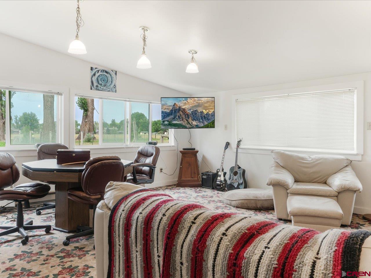 15318 6100th Road Montrose, CO 81403 - Photo 31 of 35 a bedroom with two beds and a large mirror