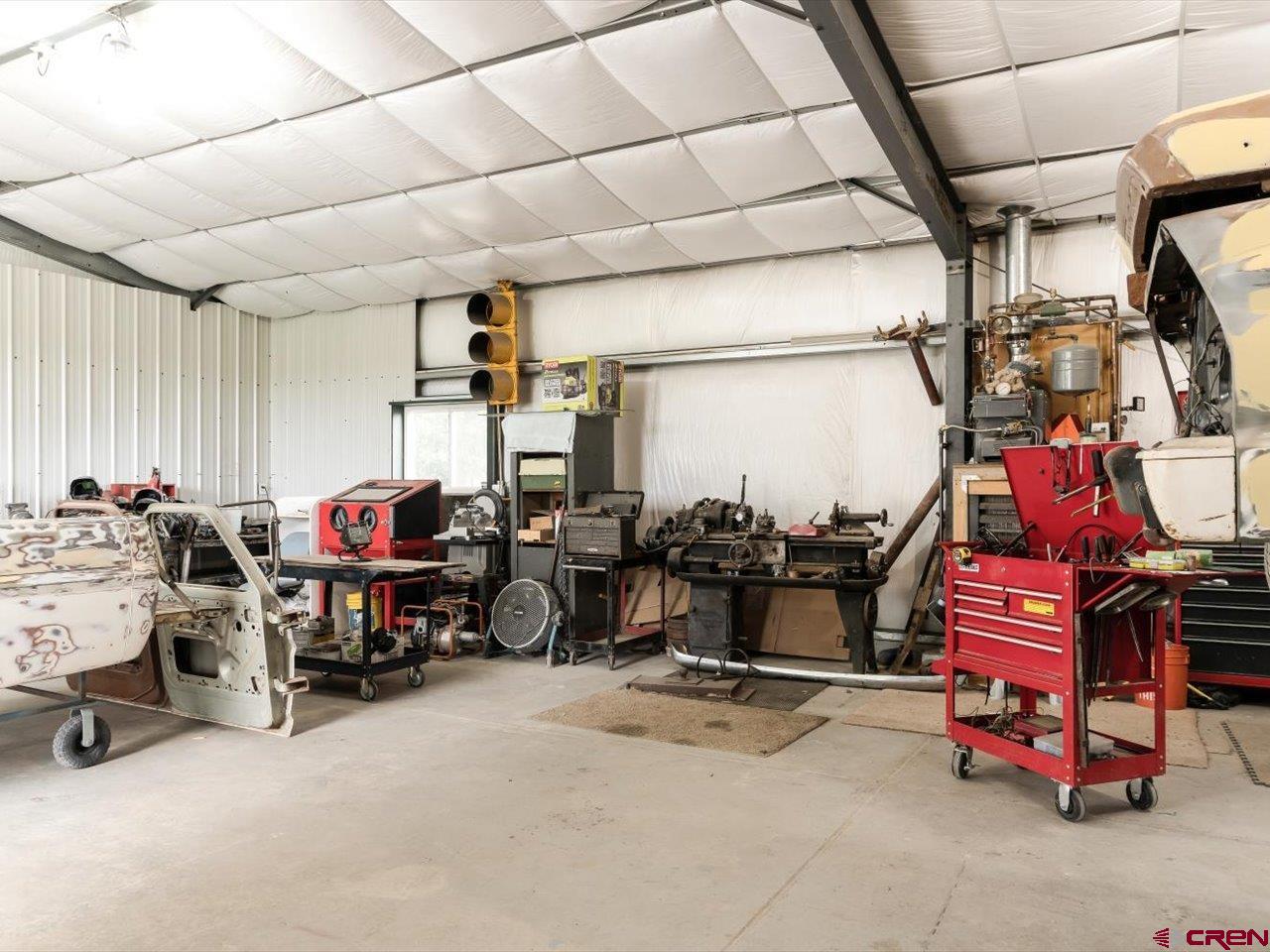 15318 6100th Road Montrose, CO 81403 - Photo 34 of 35 a view of a storage area with racks on the wall