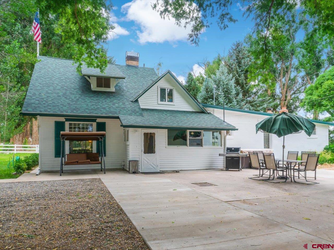 15318 6100th Road Montrose, CO 81403 - Photo 6 of 35 front view of a house with a garden