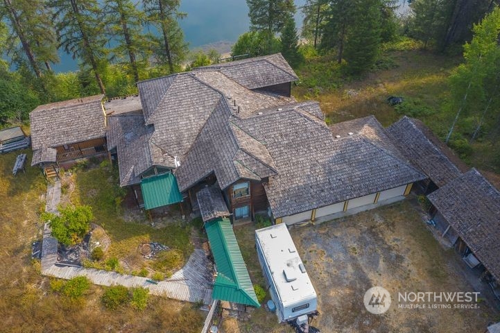 402 Northstar Road Cusick, WA 99119 - Photo 11 of 14 an aerial view of a house with garden space and lake view