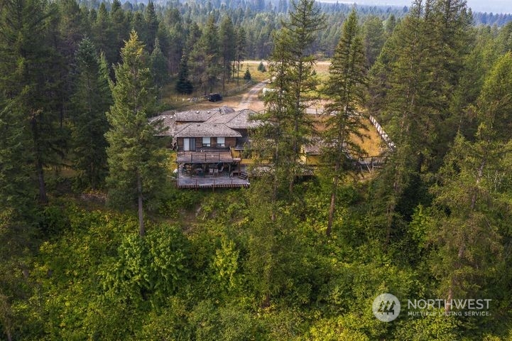 402 Northstar Road Cusick, WA 99119 - Photo 5 of 14 a view of a house with a yard