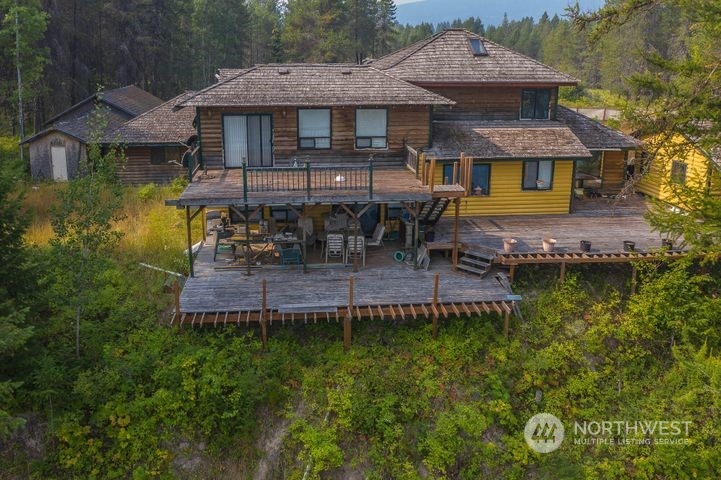 402 Northstar Road Cusick, WA 99119 - Photo 7 of 14 an aerial view of a house with swimming pool table and chairs