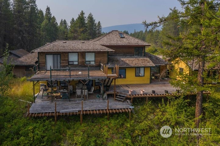 402 Northstar Road Cusick, WA 99119 - Photo 8 of 14 an aerial view of a house with swimming pool table and chairs