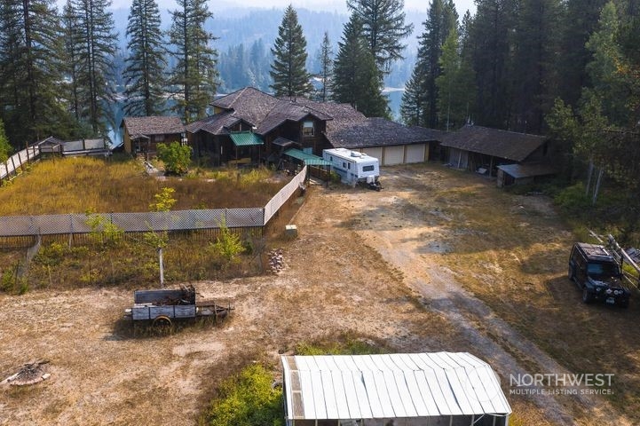 402 Northstar Road Cusick, WA 99119 - Photo 9 of 14 a backyard of a house with table and chairs
