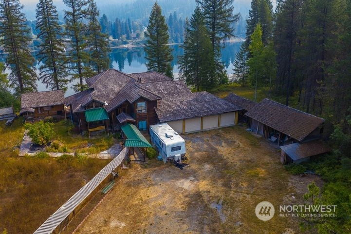 402 Northstar Road Cusick, WA 99119 - Photo 10 of 14 an aerial view of a house with swimming pool patio and outdoor seating
