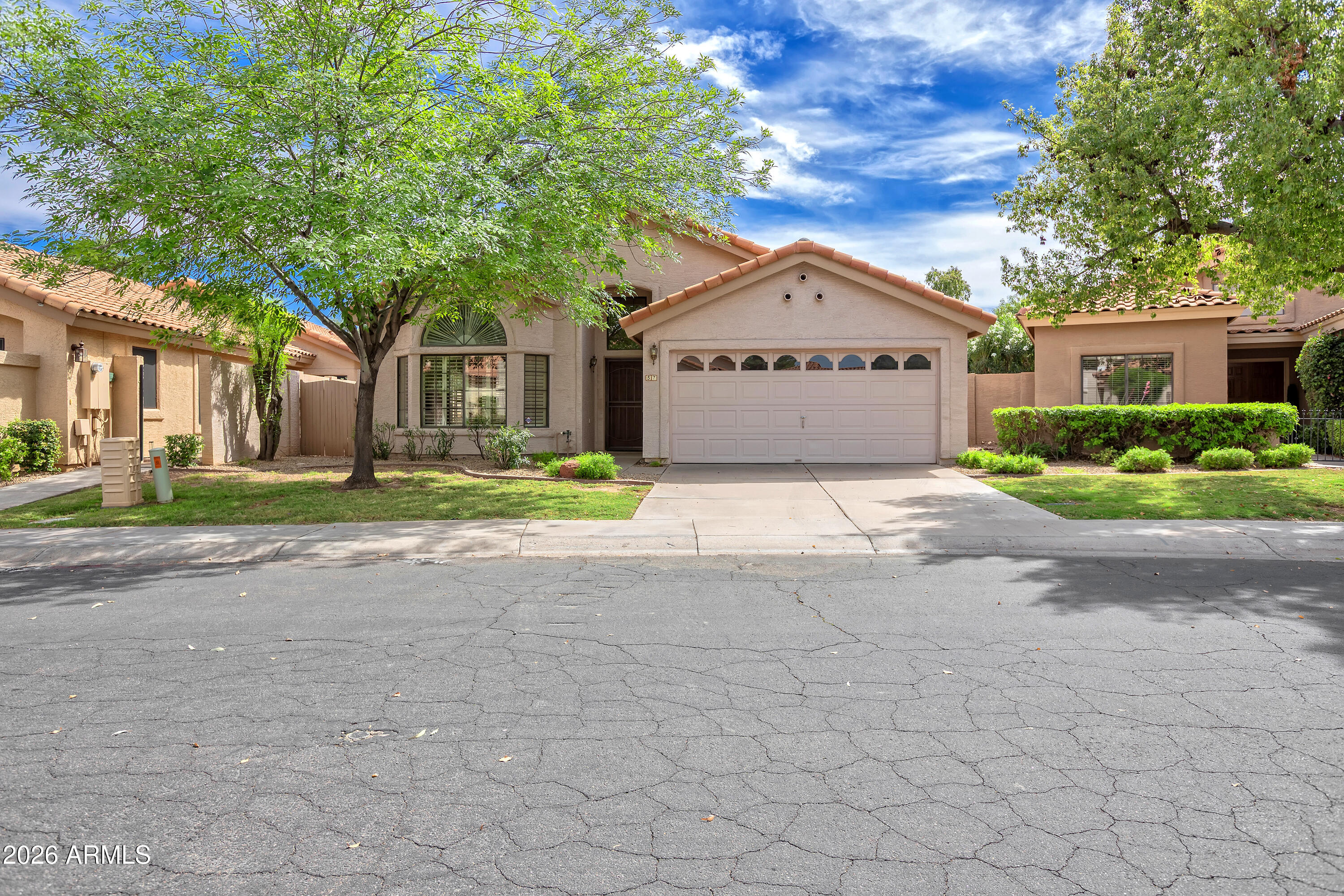 57 East Ranch Road Tempe, AZ 85284 - Photo 31 of 51 a front view of a house with a yard and garage