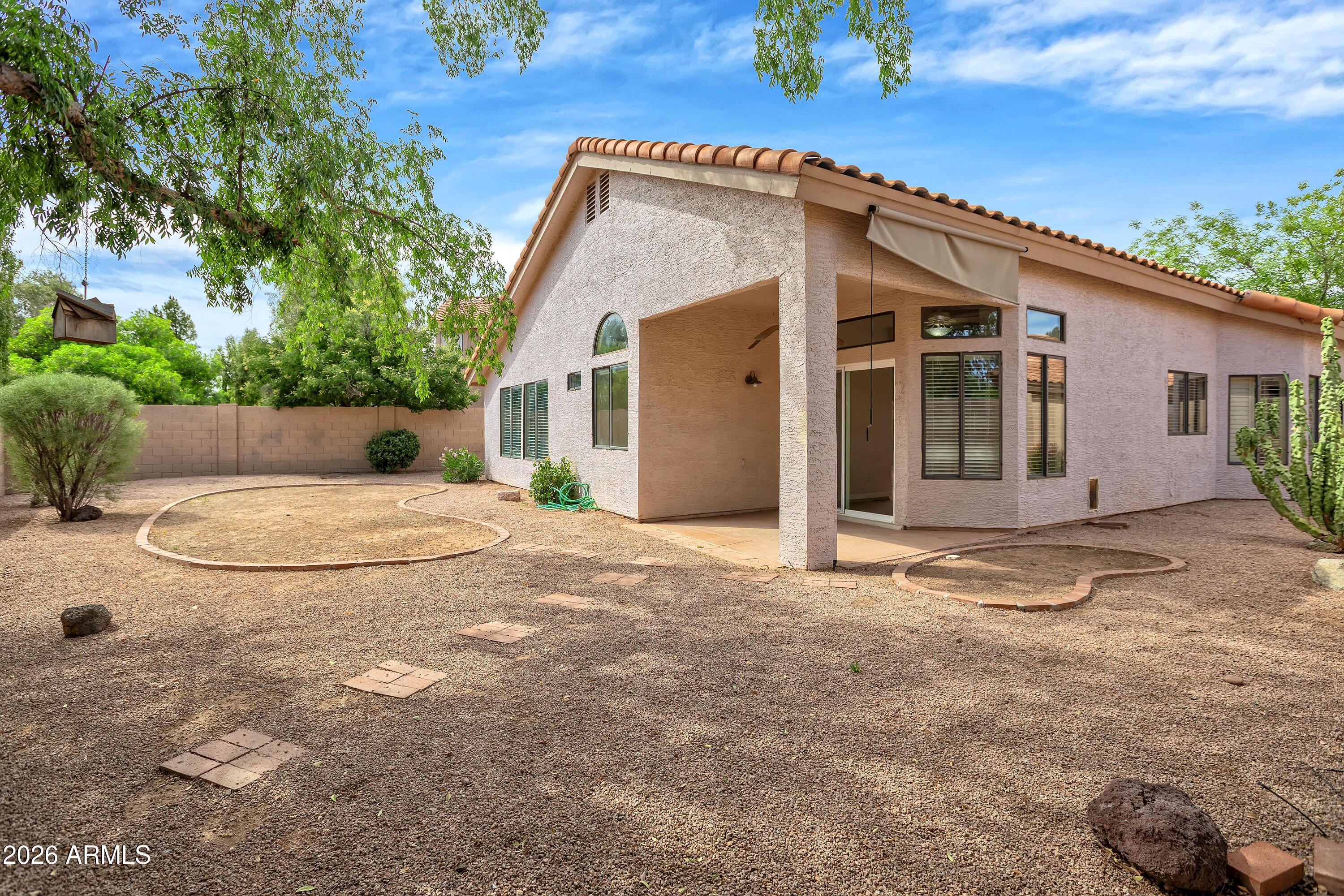 57 East Ranch Road Tempe, AZ 85284 - Photo 44 of 51 a view of a house with a yard and potted plants
