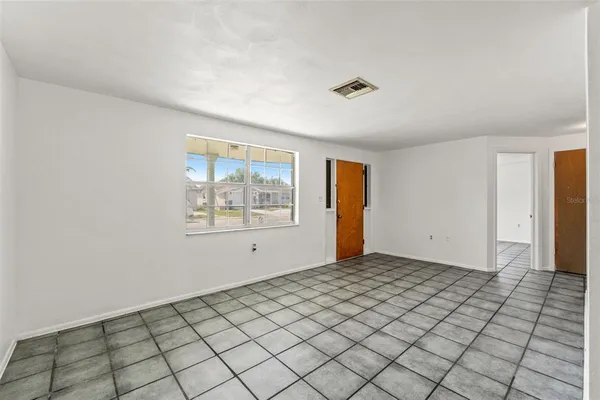 a view of an empty room and window
