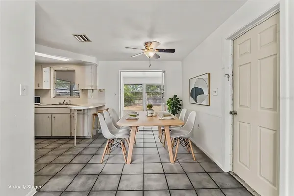 a kitchen with stainless steel appliances a sink and a refrigerator