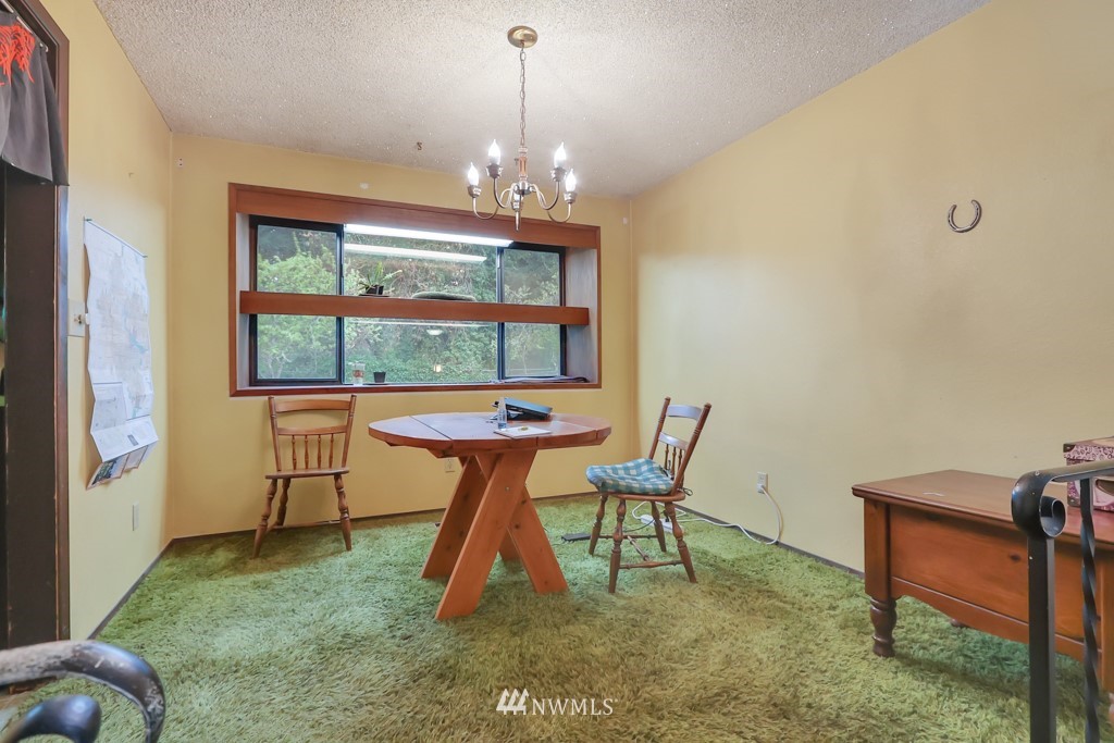 7723 Bernese Road Southwest Lakewood, WA 98498 - Photo 7 of 28 a dining room with furniture and window