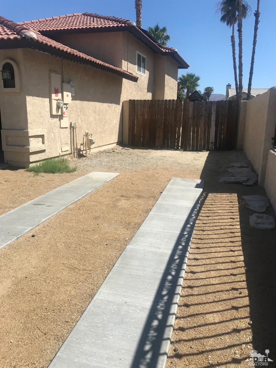 68535 Risueno Road Cathedral City, CA 92234 - Photo 11 of 15 a view of a backyard with sitting area