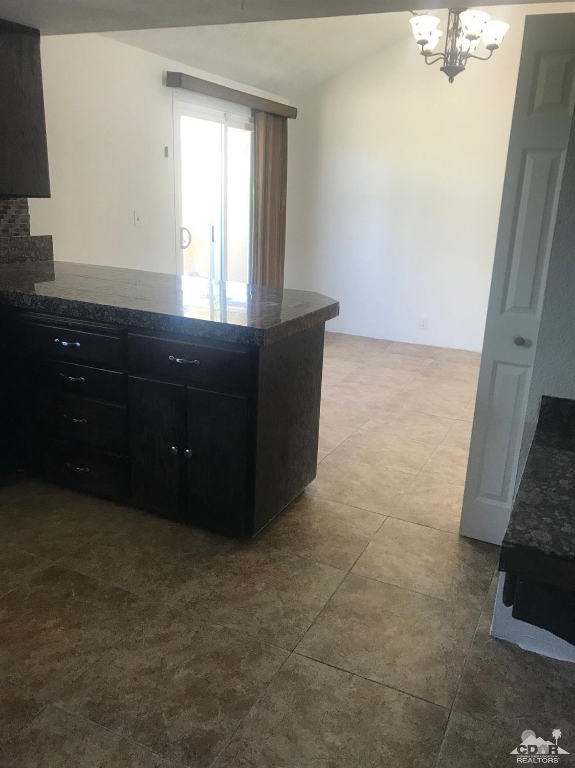 68535 Risueno Road Cathedral City, CA 92234 - Photo 8 of 15 a room with window and cabinet
