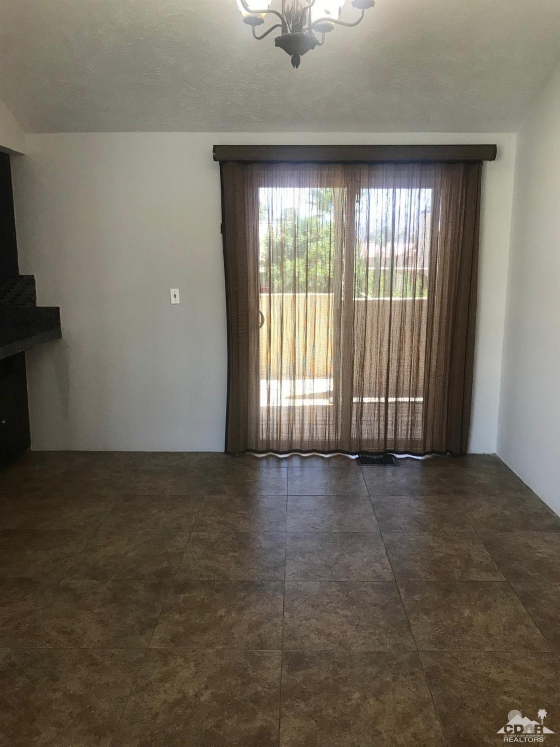 68535 Risueno Road Cathedral City, CA 92234 - Photo 9 of 15 a view of an empty room with a window