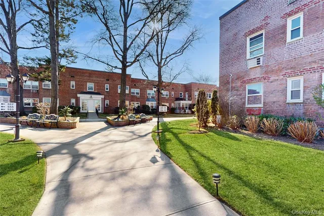 a view of a building with a yard