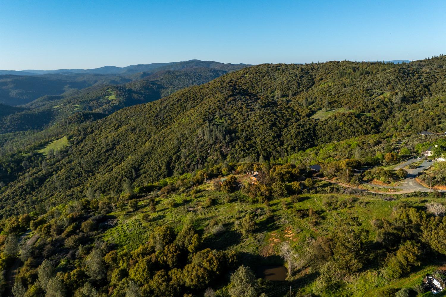 18678 Kentucky Ravine Road Nevada City, CA 95959 - Photo 9 of 11 a view of a mountain range with lush green forest
