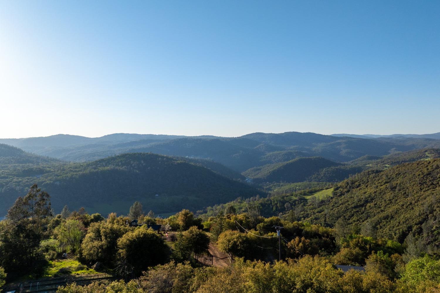 18678 Kentucky Ravine Road Nevada City, CA 95959 - Photo 10 of 11 a view of a town with mountains in the background