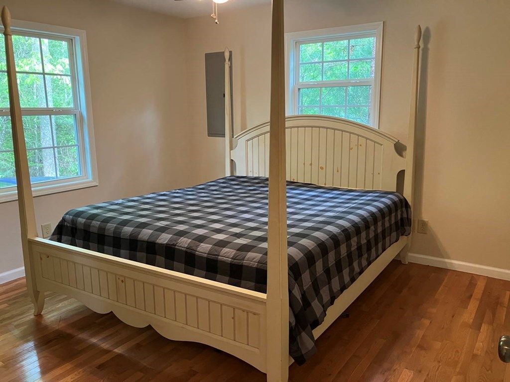 67 Brandys Way Murphy, NC 28906 - Photo 8 of 14 a bed sitting in a bedroom next to a window