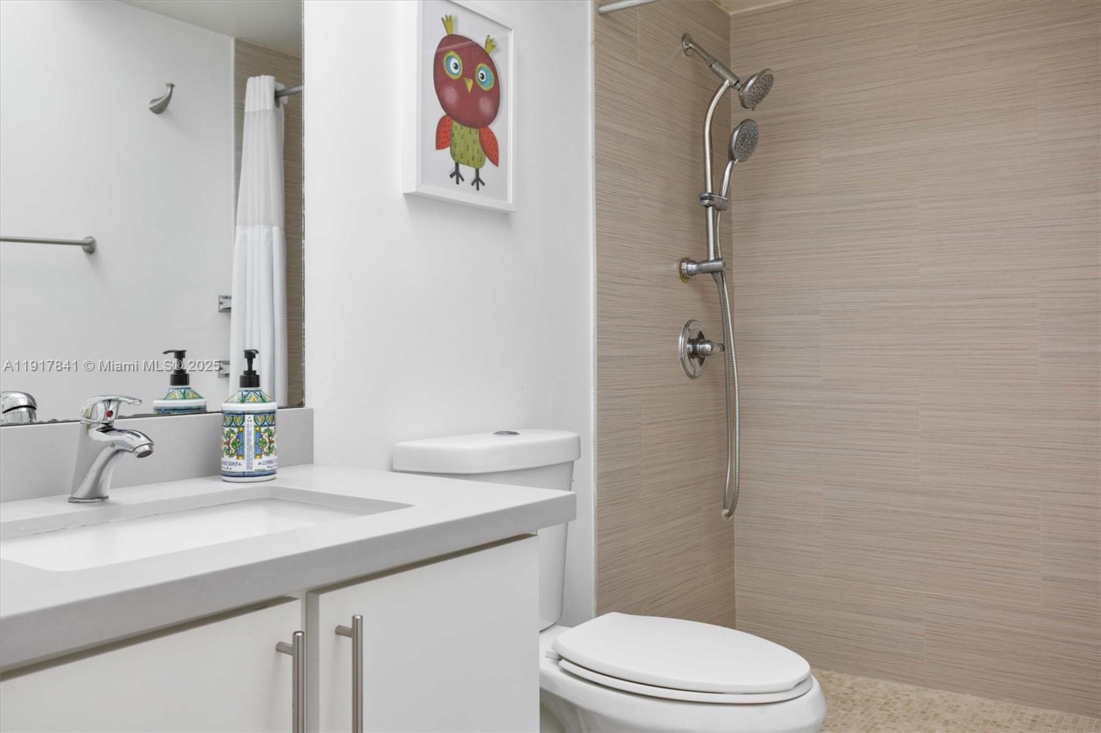 10207 Sunrise Lakes Boulevard, Unit 203 Sunrise, FL 33322 - Photo 20 of 39 a bathroom with a sink a toilet and shower