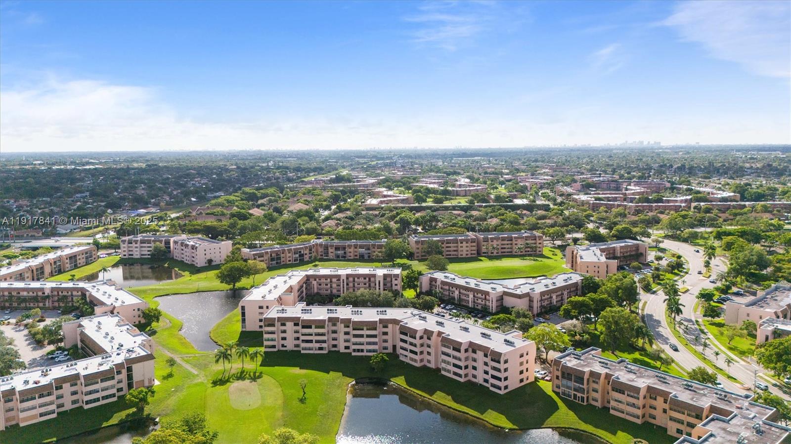 10207 Sunrise Lakes Boulevard, Unit 203 Sunrise, FL 33322 - Photo 28 of 39 a view of a city with lawn chairs
