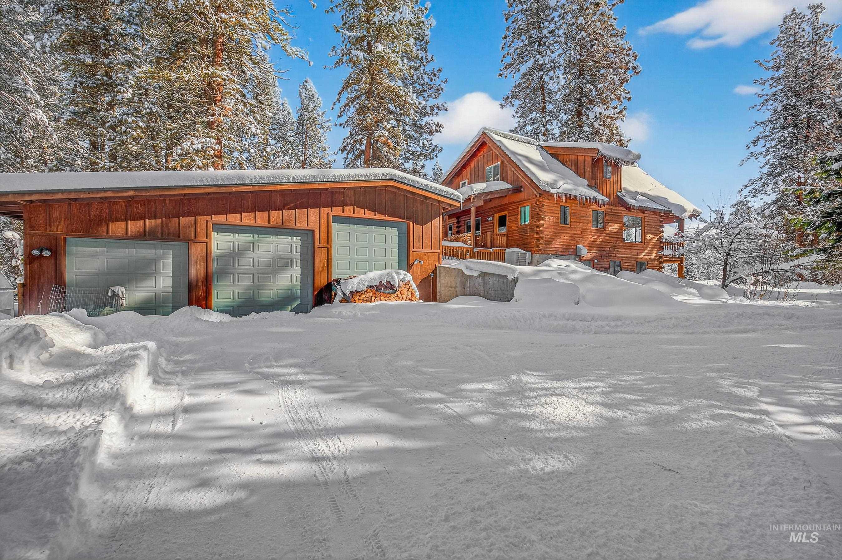 441 Allen Avenue McCall, ID 83638 - Photo 12 of 46 View of snow covered exterior featuring an outdoor structure and a garage