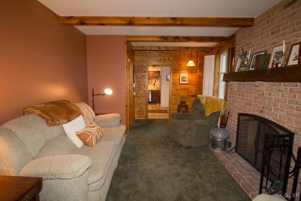 1470 Benner School Road Quakertown, PA 18951 - Photo 18 of 47 a living room with furniture and a fireplace