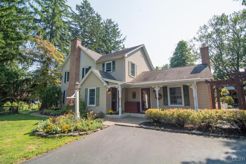 1470 Benner School Road Quakertown, PA 18951 - Photo 2 of 47 a front view of a house with garden