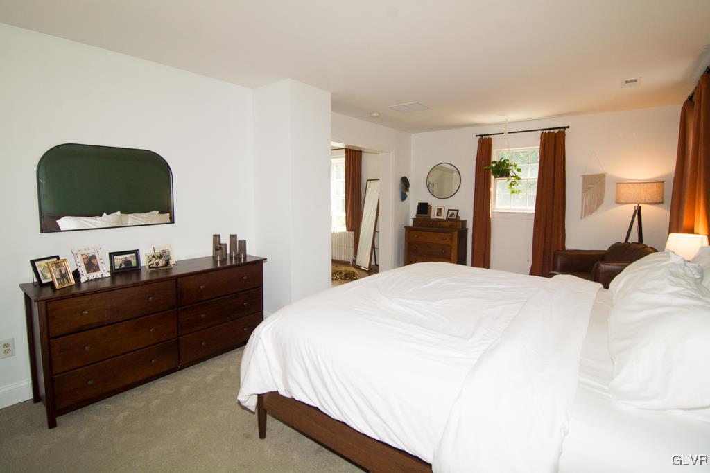 1470 Benner School Road Quakertown, PA 18951 - Photo 21 of 47 a bed room with a bed and a television