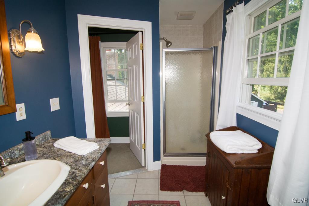 1470 Benner School Road Quakertown, PA 18951 - Photo 22 of 47 a bathroom with a granite countertop sink and a mirror