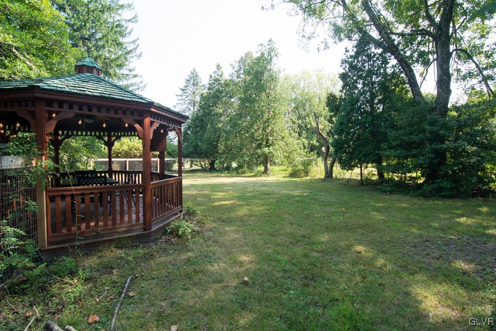 1470 Benner School Road Quakertown, PA 18951 - Photo 31 of 47 a view of a backyard with wooden fence and a large tree