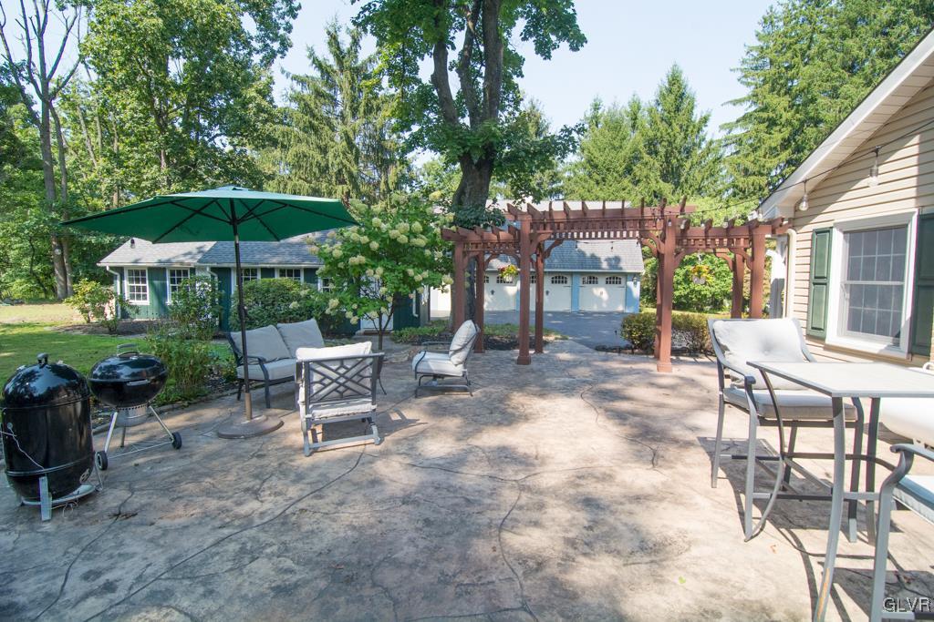1470 Benner School Road Quakertown, PA 18951 - Photo 40 of 47 a view of a patio with a table and chairs under an umbrella