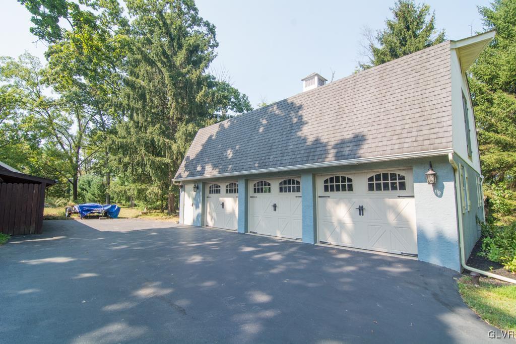 1470 Benner School Road Quakertown, PA 18951 - Photo 46 of 47 a view of a house with a yard and garage