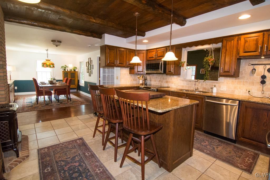 1470 Benner School Road Quakertown, PA 18951 - Photo 6 of 47 a kitchen with stainless steel appliances granite countertop a sink a stove and a refrigerator