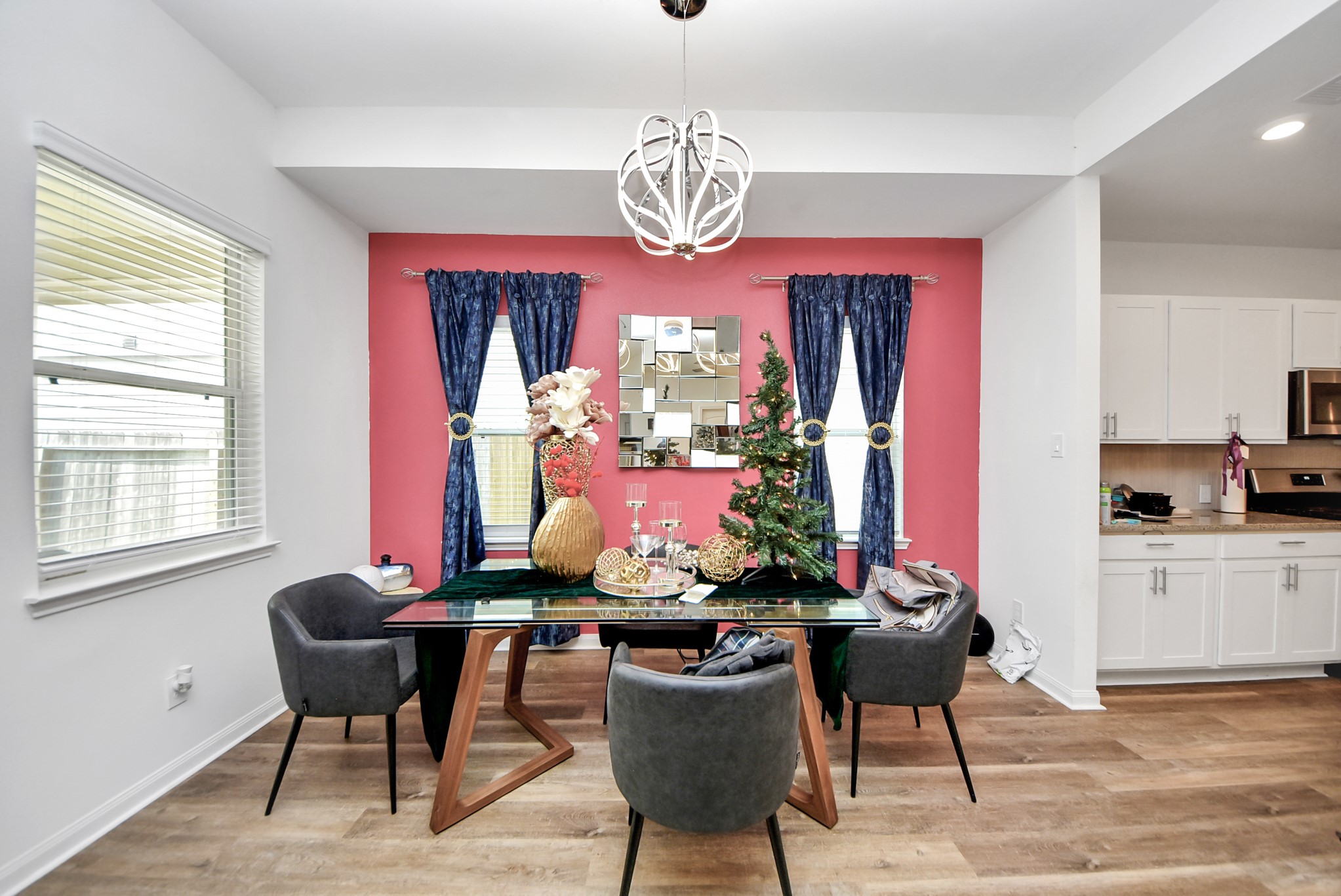 9447 Klein Lane Houston, TX 77044 - Photo 13 of 41 a view of a dining room with furniture a chandelier and wooden floor