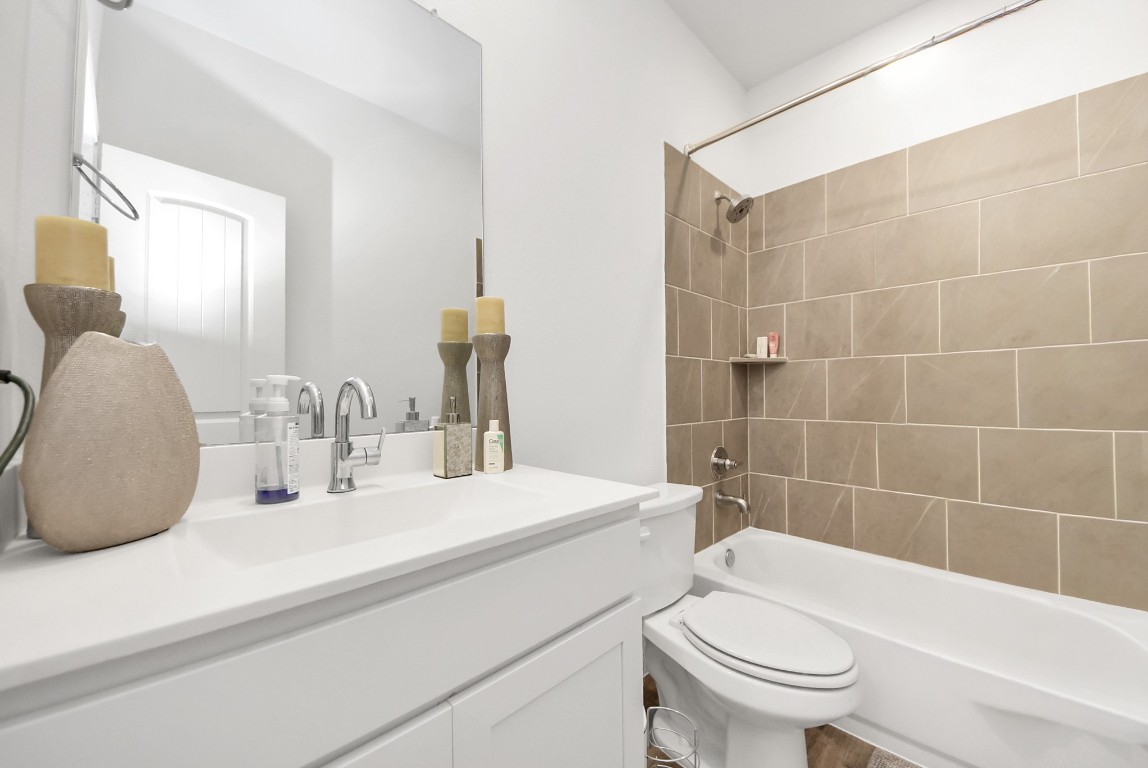 9447 Klein Lane Houston, TX 77044 - Photo 20 of 41 a bathroom with a sink a toilet and shower