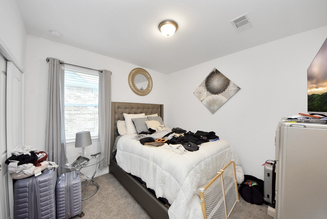 9447 Klein Lane Houston, TX 77044 - Photo 24 of 41 a bedroom with bed and a window