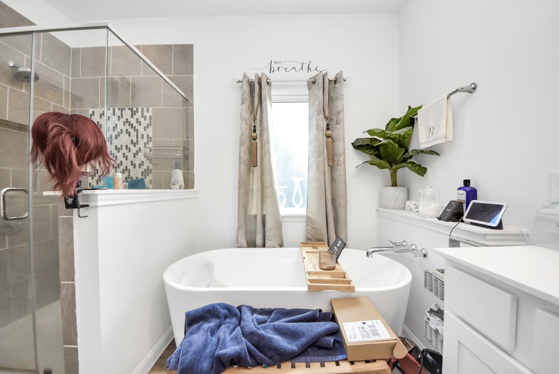 9447 Klein Lane Houston, TX 77044 - Photo 26 of 41 a bathroom with a sink and a mirror