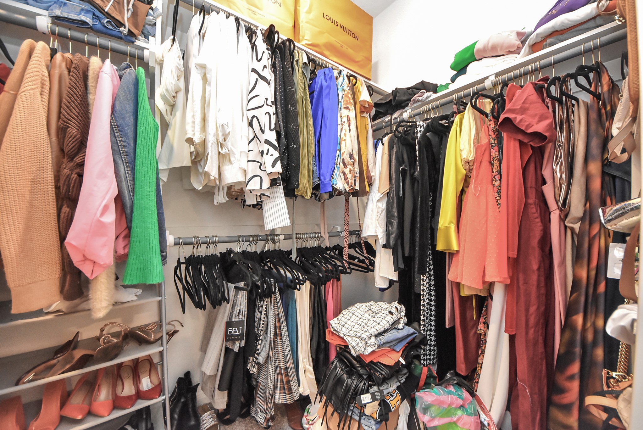 9447 Klein Lane Houston, TX 77044 - Photo 28 of 41 a view of walk in closet with clothes and shoes