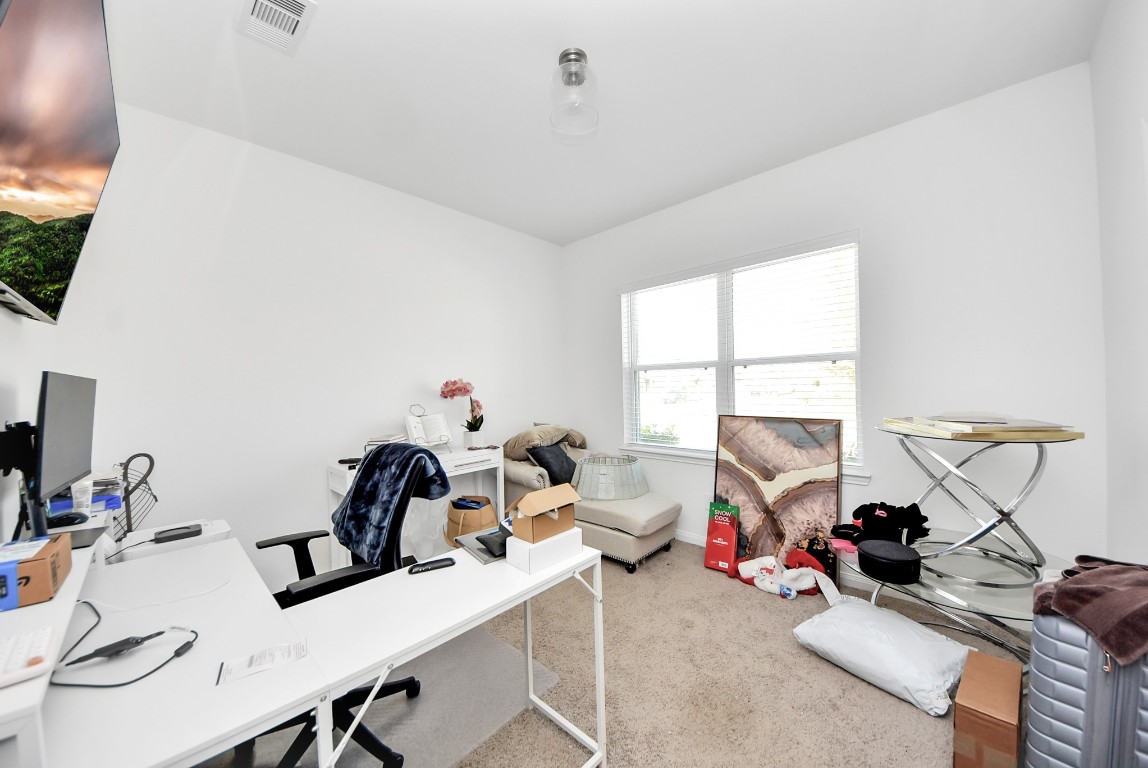 9447 Klein Lane Houston, TX 77044 - Photo 30 of 41 a view of a workspace with furniture and a window