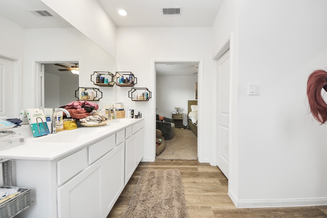 9447 Klein Lane Houston, TX 77044 - Photo 34 of 41 a kitchen with sink refrigerator and cabinets