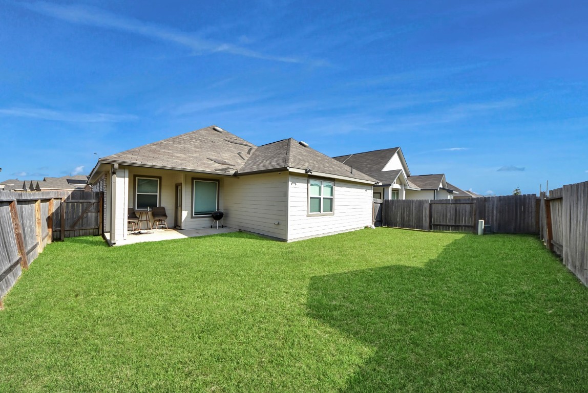 9447 Klein Lane Houston, TX 77044 - Photo 36 of 41 a front view of a house with a yard and porch