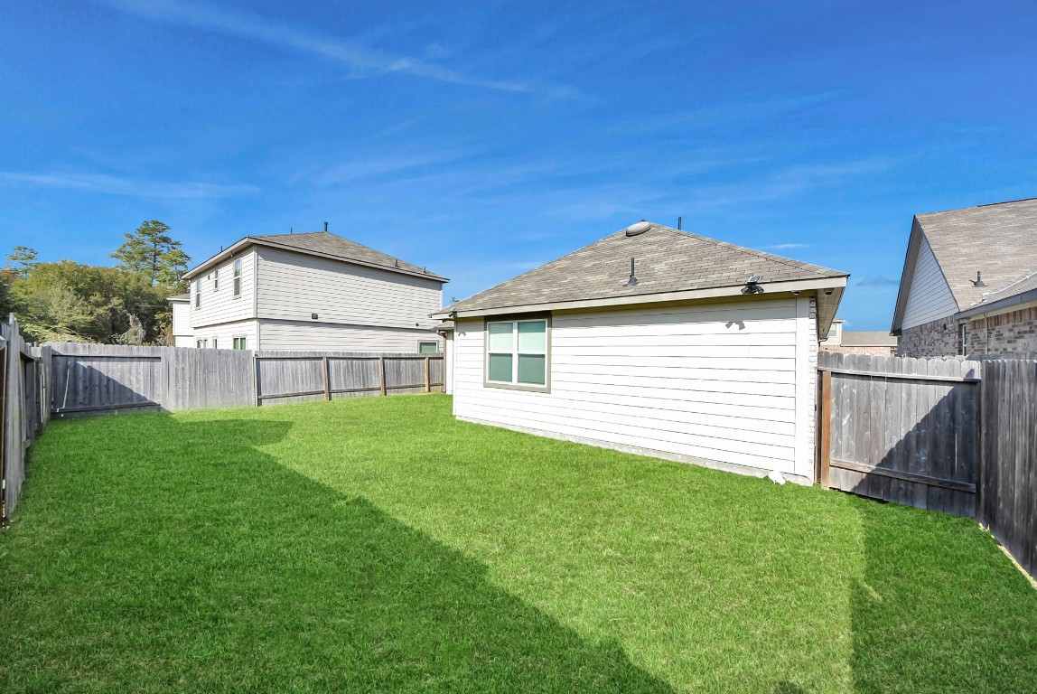 9447 Klein Lane Houston, TX 77044 - Photo 37 of 41 a view of a house with a yard