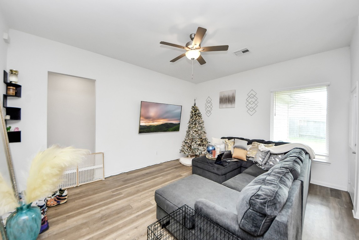 9447 Klein Lane Houston, TX 77044 - Photo 10 of 41 a living room with furniture and a wooden floor