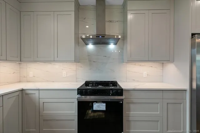 a kitchen with granite countertop a sink and a window